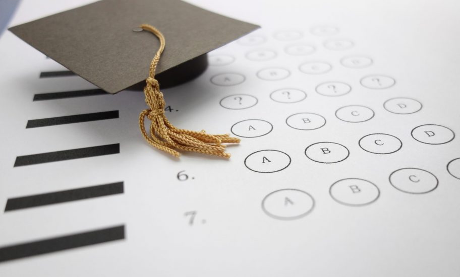 Multiple,Choice,Exam,With,Mini,Graduation,Cap Key Factors in Choosing the Right U.S. High School: A Guide for Parents